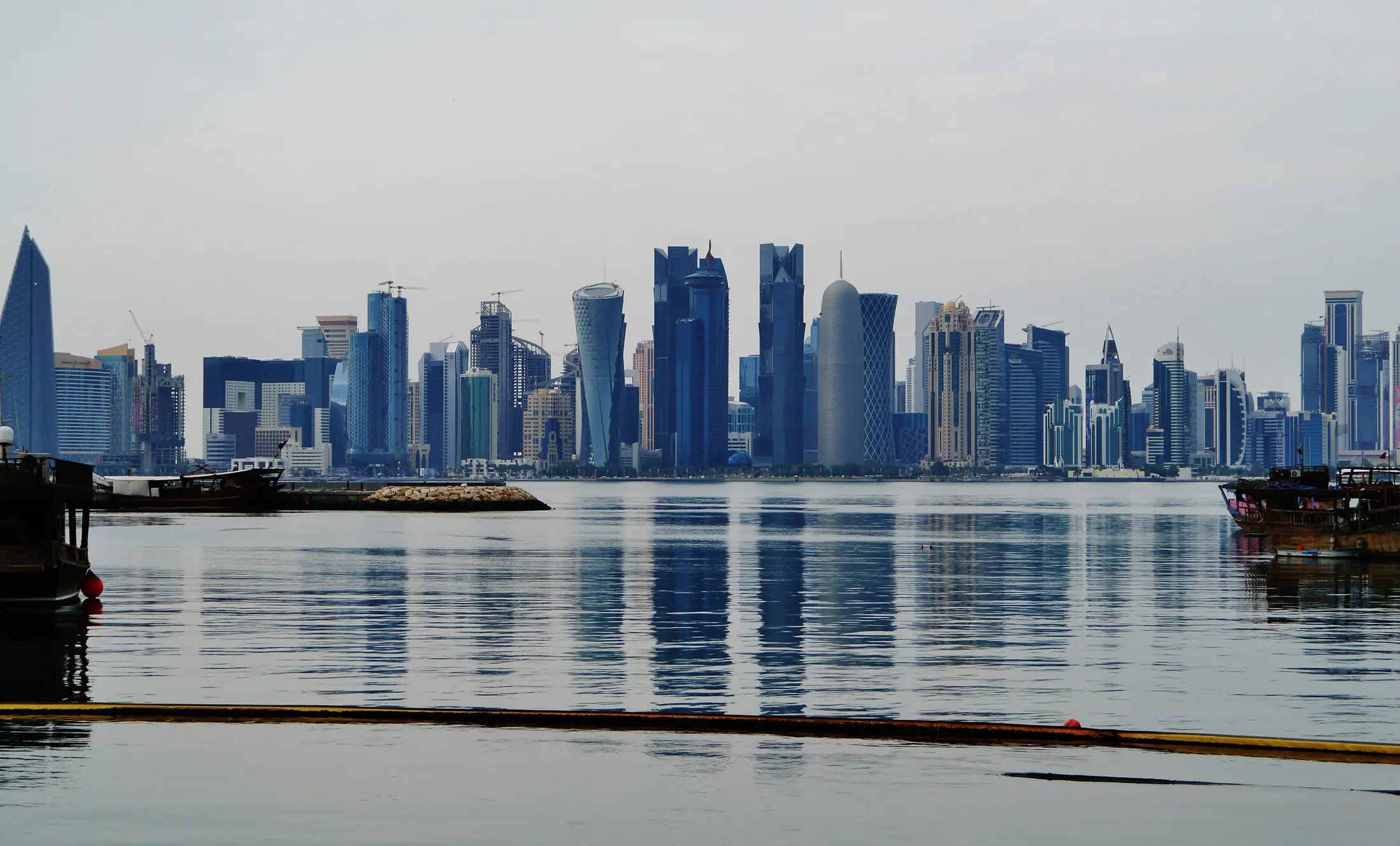 Doha skyline reflected in the bay at dusk