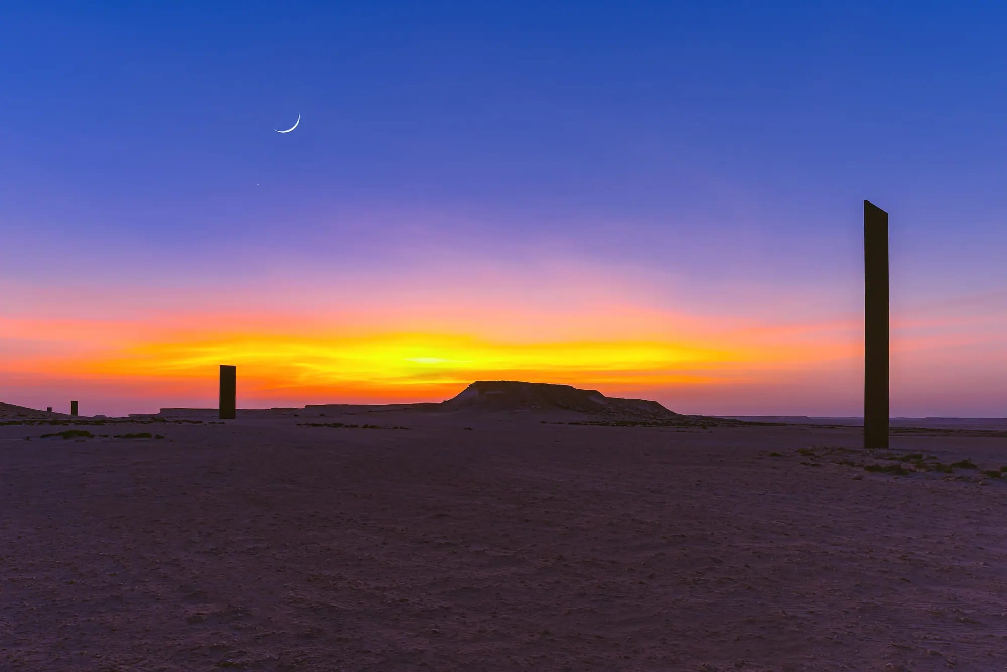 Richard Serra's East-West/West-East sculpture at sunset